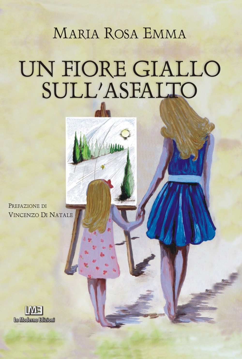 Un fiore giallo sull'asfalto